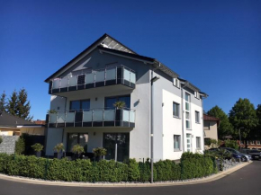 Отель Moderne Neubau Ferienwohnung  Казель